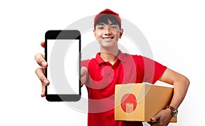 Asian delivery man carrying paper parcel Showing his payment application on the smart phone on white background. Shopping via