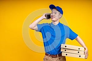 Asian delivery man using mobile phone call to customer