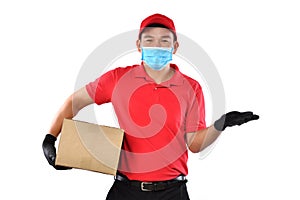 Asian delivery man wearing face mask and gloves in red uniform delivering parcel box isolated on white background during COVID-19