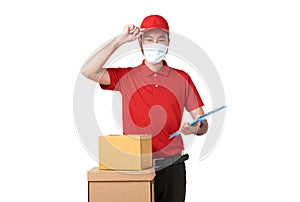 Asian delivery man wearing face mask in red uniform standing with parcel post box isolated over white background. express delivery