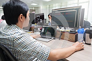 Asian Developer Using Laptop Computer Sitting