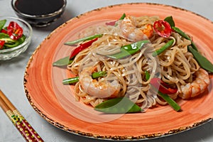 Asian dish of fried rice noodles with shrimp and vegetables