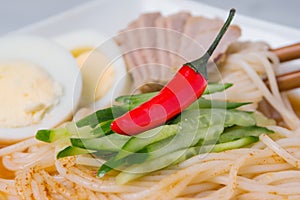 Asian dish. Noodles with hot pepper