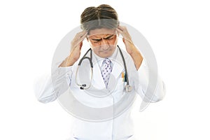 Asian doctor having a headache