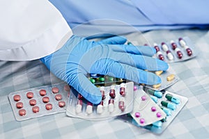 Asian doctor holding antibiotics capsule pills in blister packaging for treatment infection patient in hospital, Pharmacy