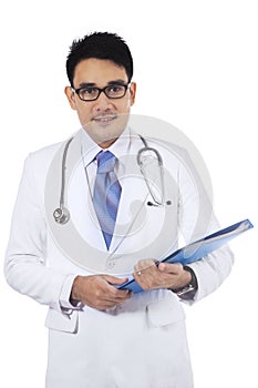 Asian doctor holding medical document