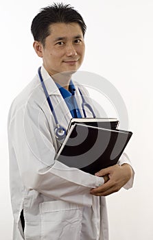 Asian Doctor holding patients records