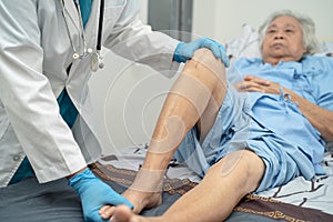 Asian doctor inject Hyaluronic acid platelet rich plasma into the knee of senior woman to walk without pain