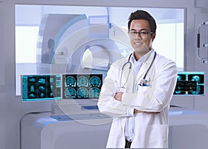 Asian doctor in MRI room at hospital