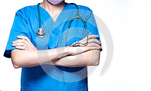 Asian doctor or nurse wear blue scrubs uniform with stethoscope. Physician stand with arms crossed isolated on white background.