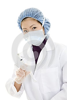 Asian doctor or nurse wearing a lab coat and preparing a vaccination