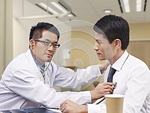 Asian doctor and patient
