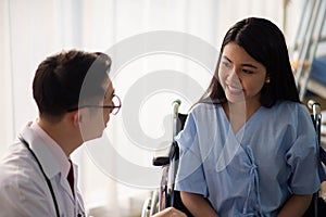 Asian Doctor and patient talking and checking  health care medical sickness at hospital