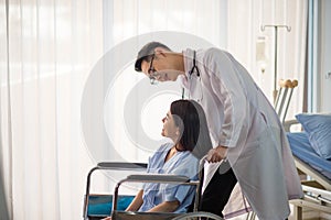 Asian Doctor and patient talking and checking  health care medical sickness at hospital