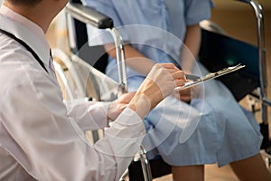 Asian Doctor and patient talking and checking  health care medicall sickness at hospital