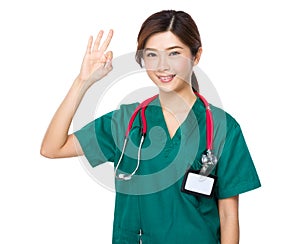 Asian doctor showing okay sign