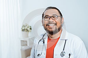 Asian doctor smiling to camera