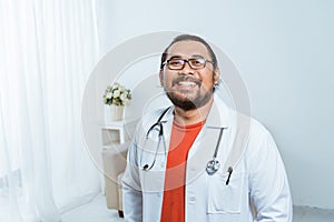 Asian doctor smiling to camera