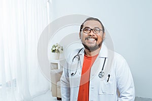 Asian doctor smiling to camera