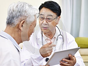 Asian doctor talking to patient