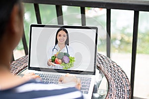 Asian doctor or therapist help relieve stress and provide knowledge and understanding about Nutrition and health food to patients