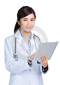 Asian doctor using digital tablet