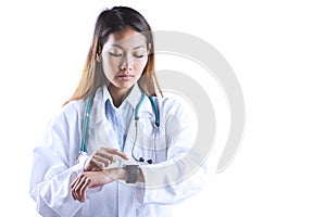 Asian doctor using her smart watch