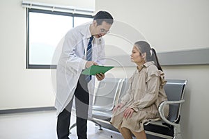 Asian Doctor is working in hospital , talking with sadness woman , medical health care concept
