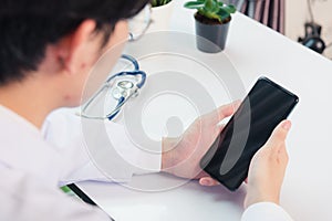 Doctor woman smiling using working with smart mobile phone