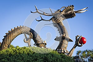 Asian Dragon statue with blue sky