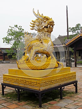 Asian dragon yellow sculpture