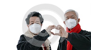 Asian elder senior couple encourage and support to win fight Coronavirus while wearing mask protection