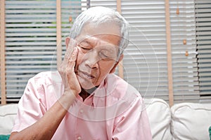 Asian elderly men have toothache.