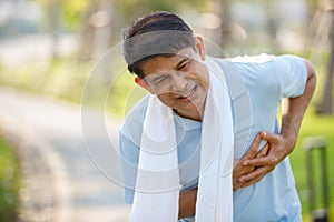 Asian elderly or senior man touching chest having painful.