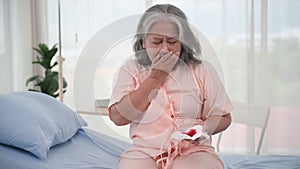 Asian elderly woman has a coughing up blood and chest pain