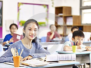 Asian elementary schoolgirl in class