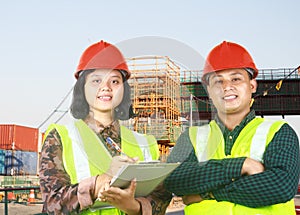 Asian enggineer standing on construction site