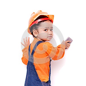 Asian Engineer baby with eraser brush in hand