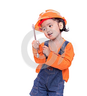 Asian Engineer baby girl and wrench in hand