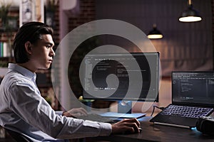 Asian engineer developing app software
