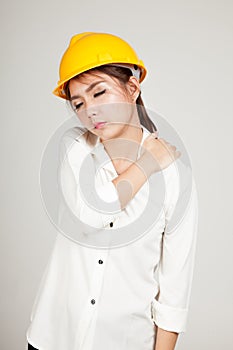 Asian Engineer girl with hard hat got back pain