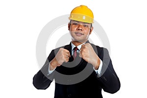 Asian engineer man with his fist rise ready to fig