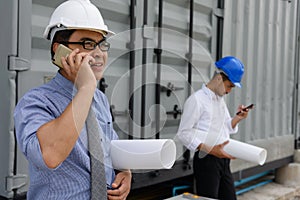 Engineer team using smartphone at construction site
