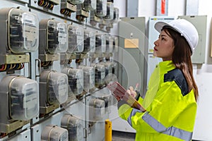 Asian engineer wearing glasses working in the boiler room