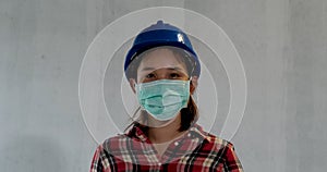 Asian engineer women wear protective face masks for safety at construction site