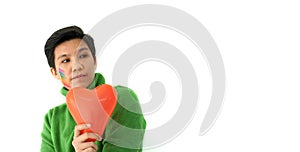 Asian ethnic LGBT tomboy holding heart shape balloon looking for good date and relationship