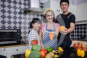 Asian families are cooking  and parents are teaching their daughters to cook in the kitchen at home. .Family activities on