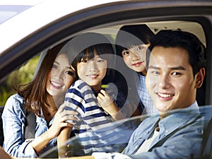 Asian family enjoying a car ride