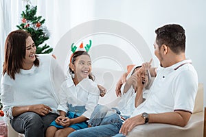 Asian family enjoying christmas day together