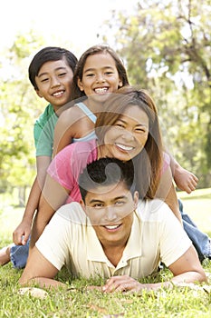 Asian Family Enjoying Day In Park